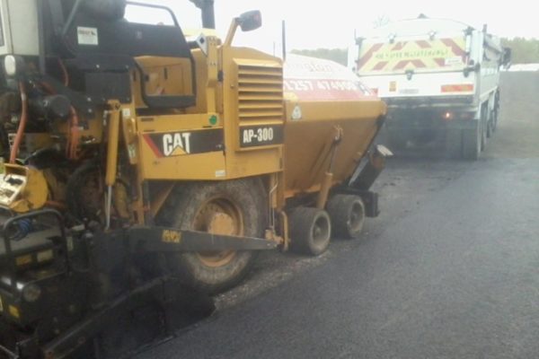 CAT machine working on car park